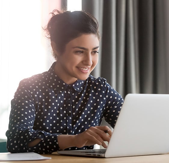 woman typing on laptop