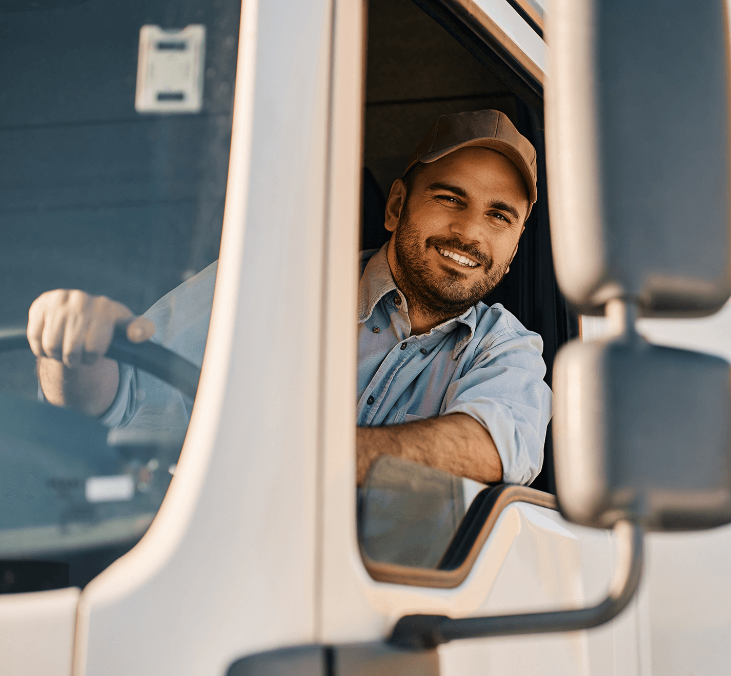 Smiling trucker driving